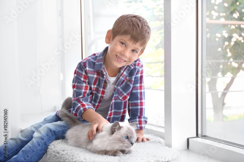 Cute little boy with fluffy...