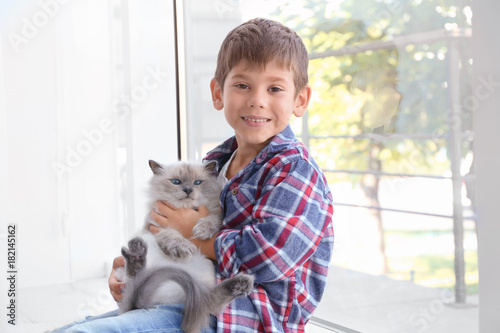 Cute little boy with fluffy...