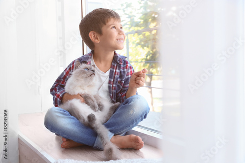 Cute little boy with fluffy...