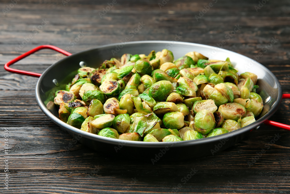 Frying pan with roasted brussel sprouts on table Frying pan with roasted brussel sprouts on table