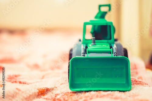 a toy tractor in the nursery photo