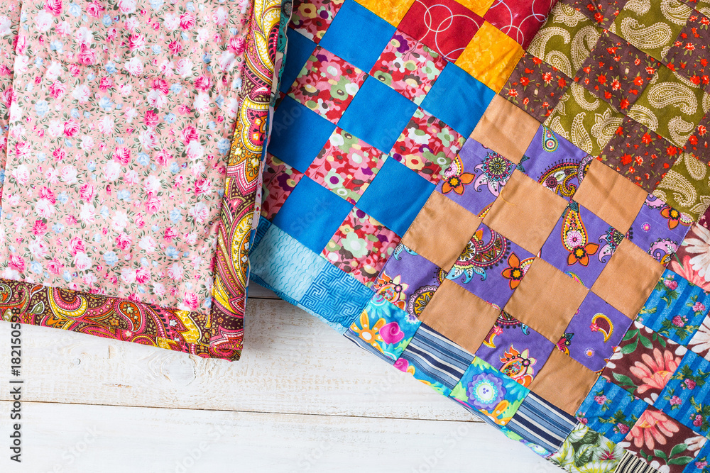 Obraz premium design, culture, home, comfort, warmth, rest concept - cosy quilts sewed in old russian traditions of cotton patches with different colores and patterns