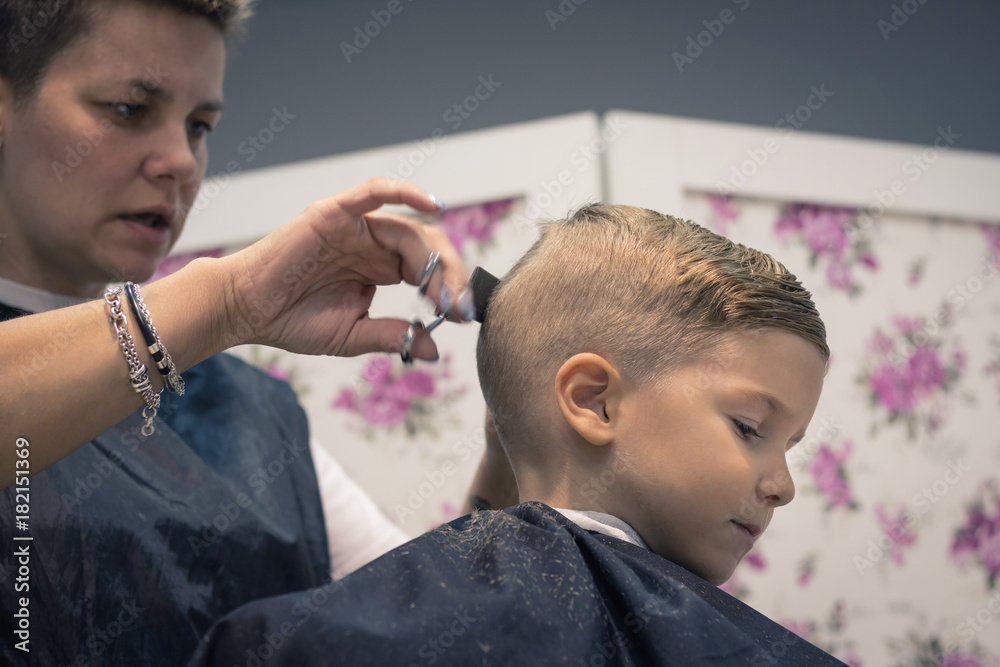 Little boy during haircut at hairdresser's. Little boy during haircut at hairdresser's.