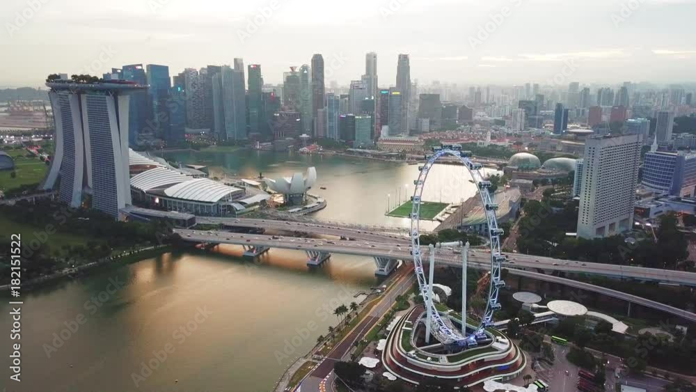 Singapore. November 21, 2017: Aerial view footage of Singapore Flyer with the city skyline, Marina Bay Sands Hotel, skyscrapers. Shot in 4k resolution