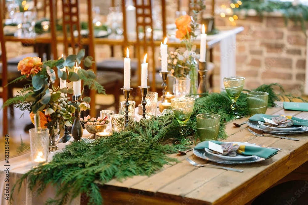 wedding, floral design, treat concept. amazing decor of restaurant table for lovers, on corners of it there are bouquets of nice flowers and at the center of table there are branches of conifer trees wedding, floral design, treat concept. amazing decor of restaurant table for lovers, on corners of it there are bouquets of nice flowers and at the center of table there are branches of conifer trees