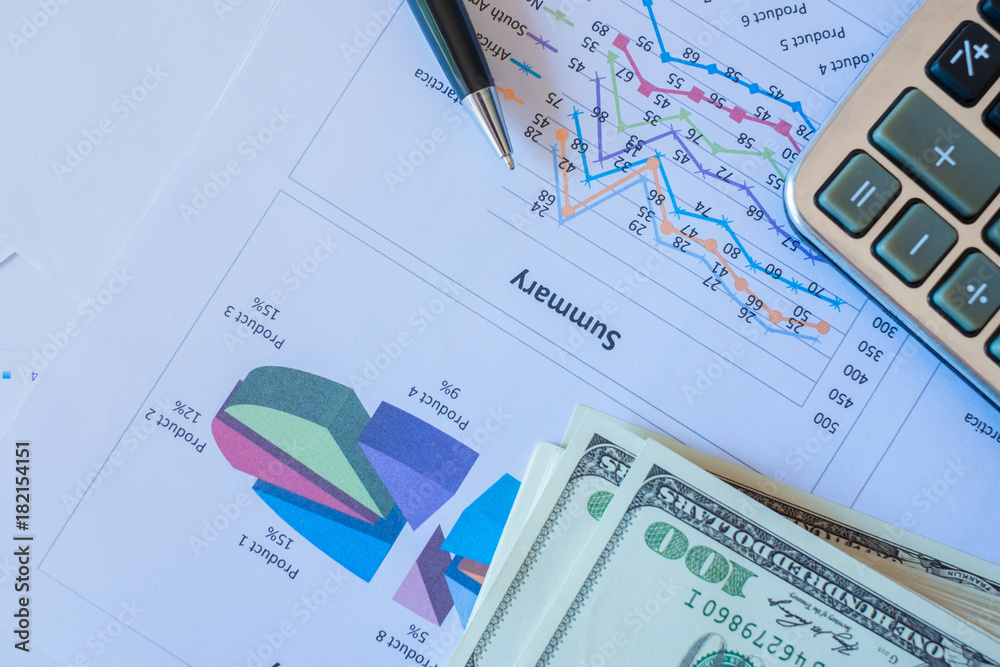 Accounting data, charts, calculator and pen. Many charts and graphs. Reflection background. Accounting data, charts, calculator and pen. Many charts and graphs. Reflection background.