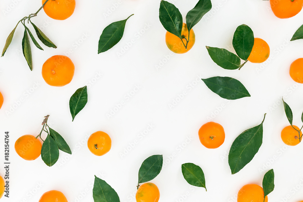 Frame made of fresh citrus and leaves on white background. Flat lay. Top view