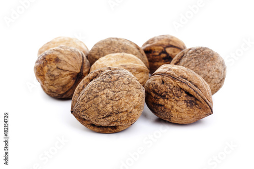 Walnuts on isolated white studio photo. Walnut with shell.