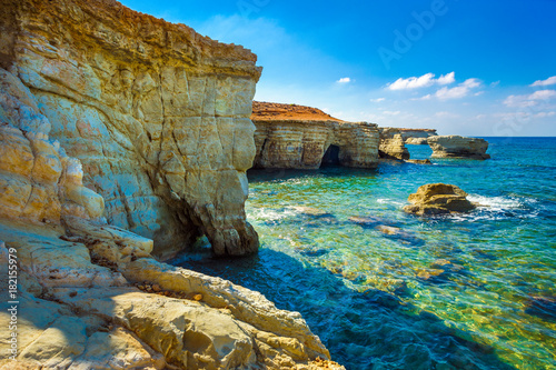 Sea caves on Coral bay coastline, Cyprus, Peyia, Paphos district photo