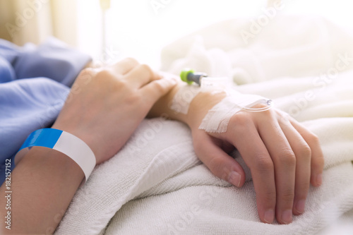 female patient sleeping on the patient bed in the room after surgery at the hospital with sunbeem.