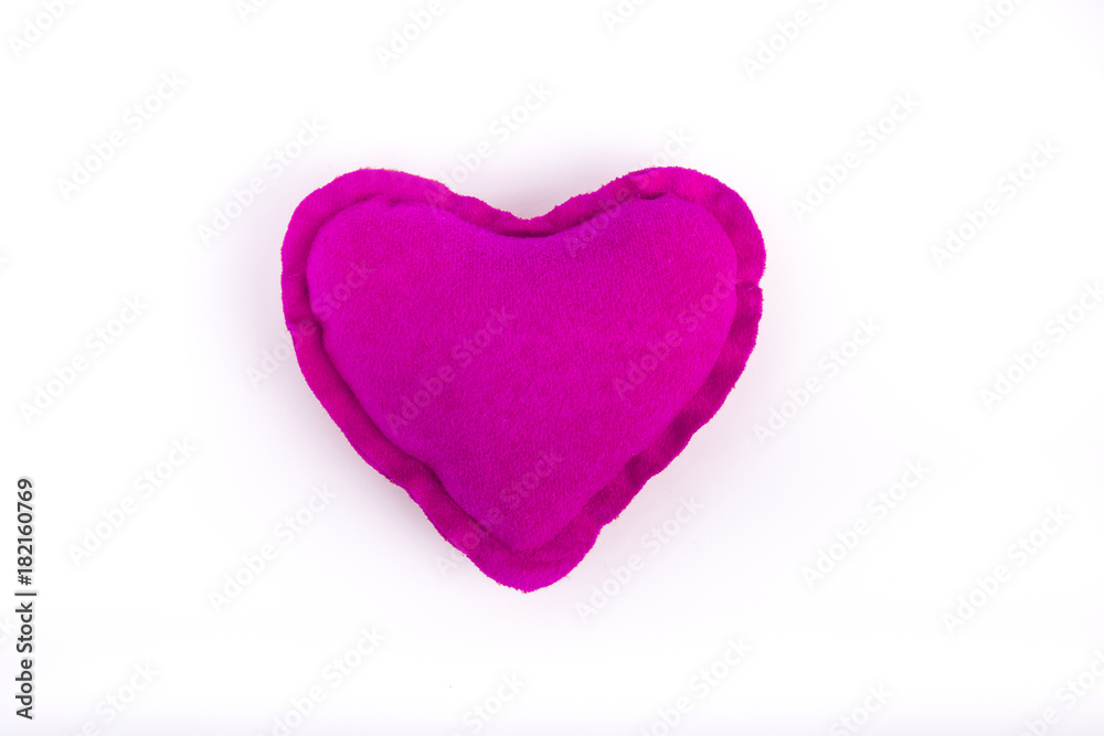 Table top shot of pink heart on white background