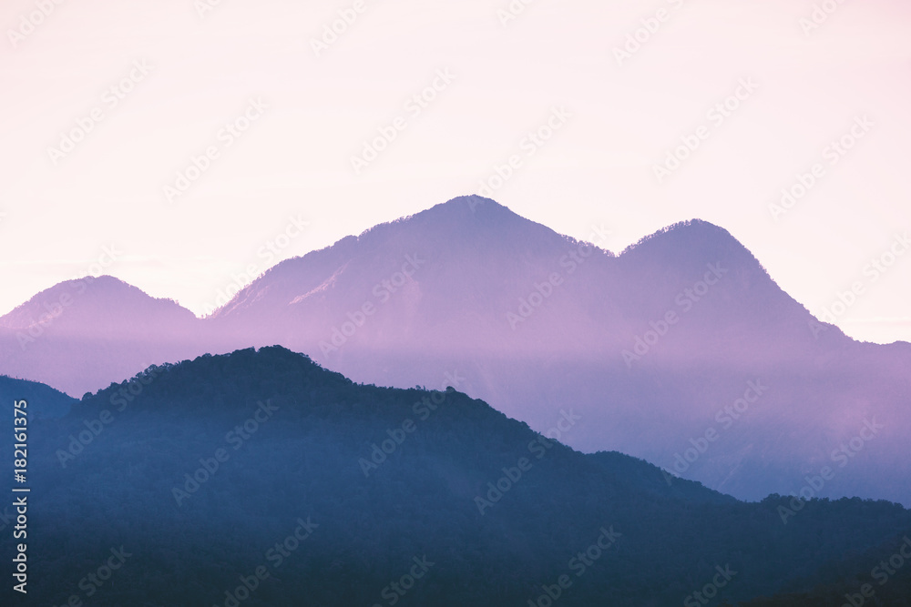 Mountain peaks touching light after sunset turned to sweet purple color at Sun Moon Lake, Nantou of Taiwan.