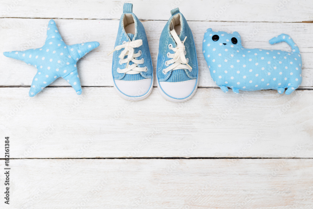 Children's sneakers and  toys blue. Mockup