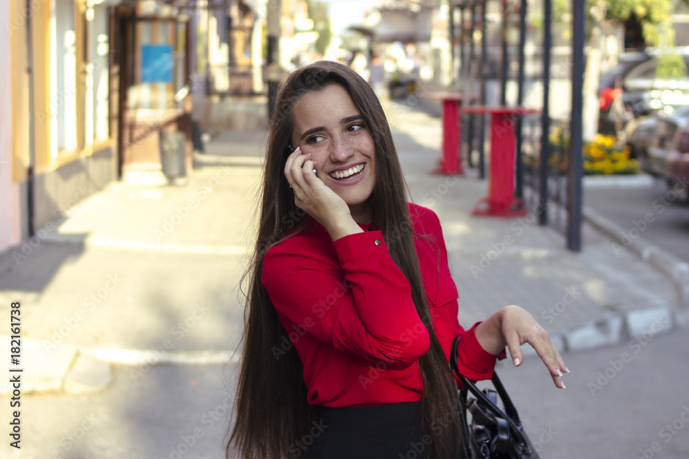 Fototapeta premium Girl talking on the phone