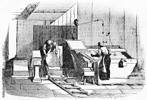 Two men working on a paper sheets production in an ancient paper factory. Old Illustration by unidentified author, published on Magasin Pittoresque, Paris, 1834 photo