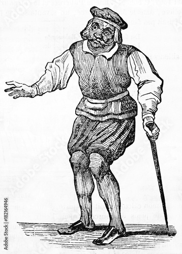 ancient comic masked character Jacquemin Jadot posing on stage with his scene clothes and holding a stick (17th century). Old Illustration by unidentified author on Magasin Pittoresque Paris 1834 photo