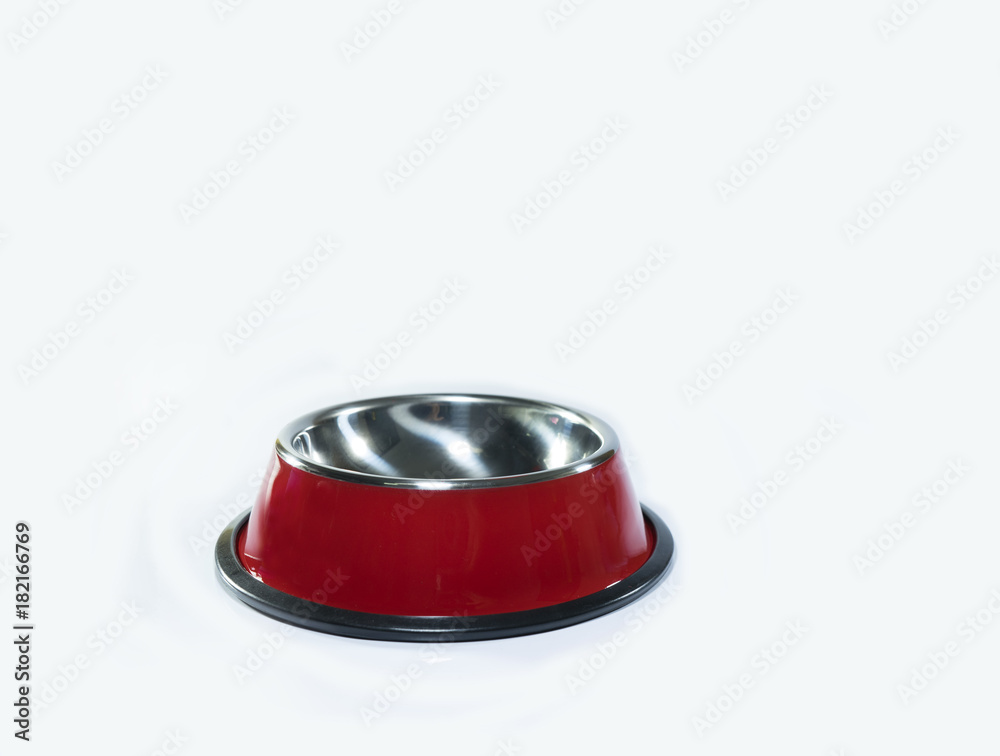 Pet supplies : Stainless bowl of red for dog or cat on isolated Pet supplies : Stainless bowl of red for dog or cat on isolated