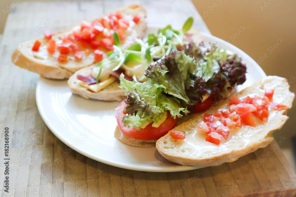 canape , bread with ham and cheese