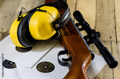 shooting, pneumatic and firearms on a wooden table. Table on the shooting range, weapons and shooting accessories.