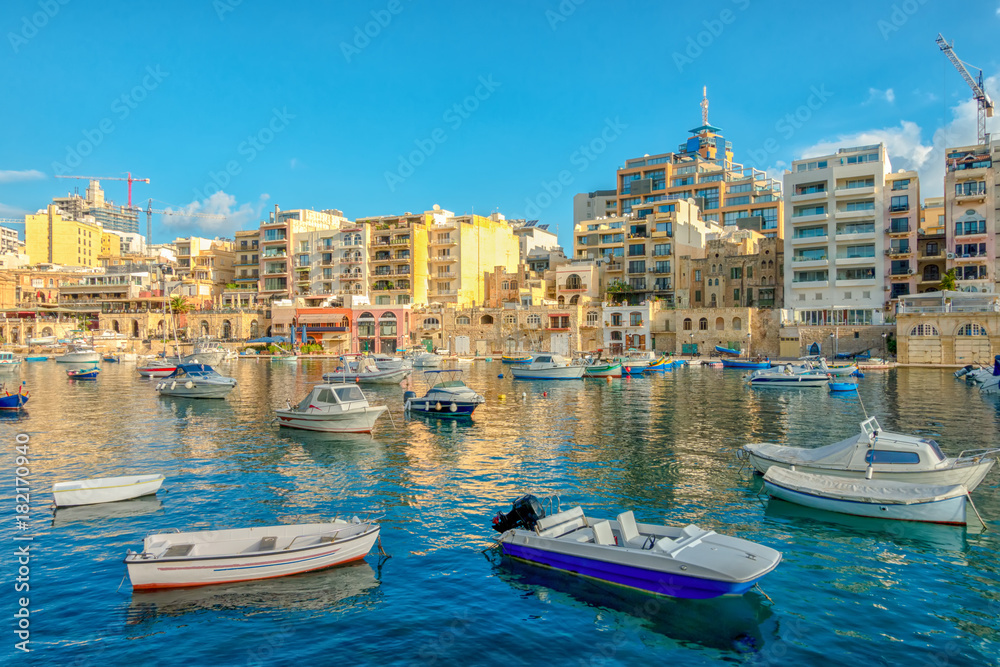 beautiful view of harbor with maltese yachts and boats in Sliema, Spinola Bay, Malta