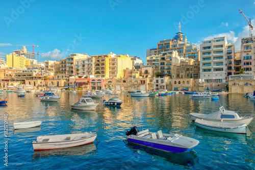 beautiful view of harbor with maltese yachts and boats in Sliema, Spinola Bay, Malta