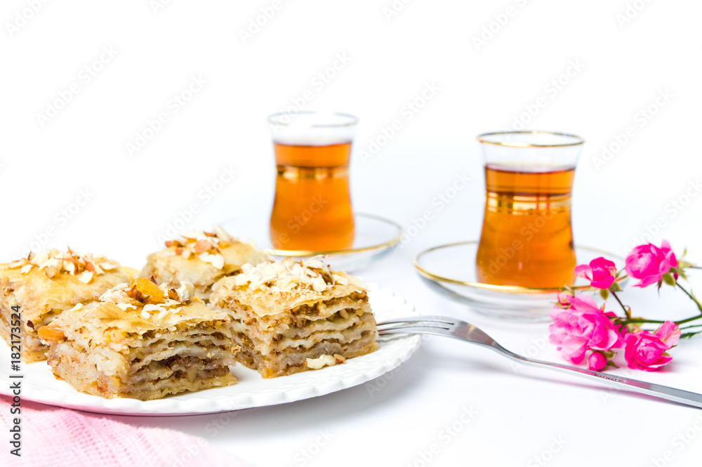Baklava and turkish tea on white background