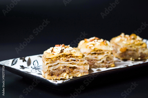 Baklava dessert slices on dark background
