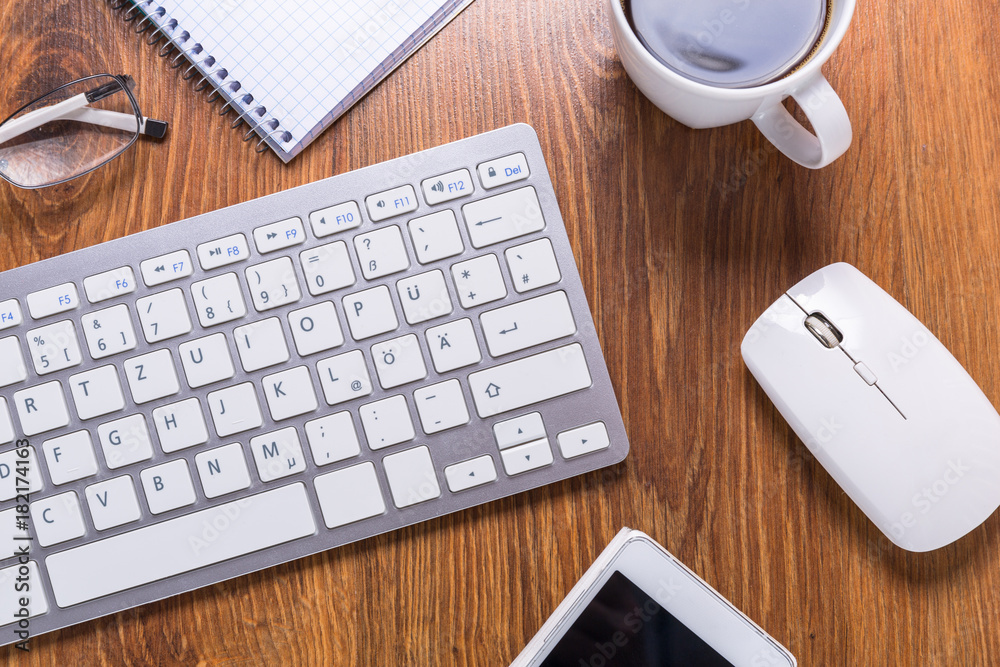Modern office workplace with a cup of coffee Modern office workplace with a cup of coffee