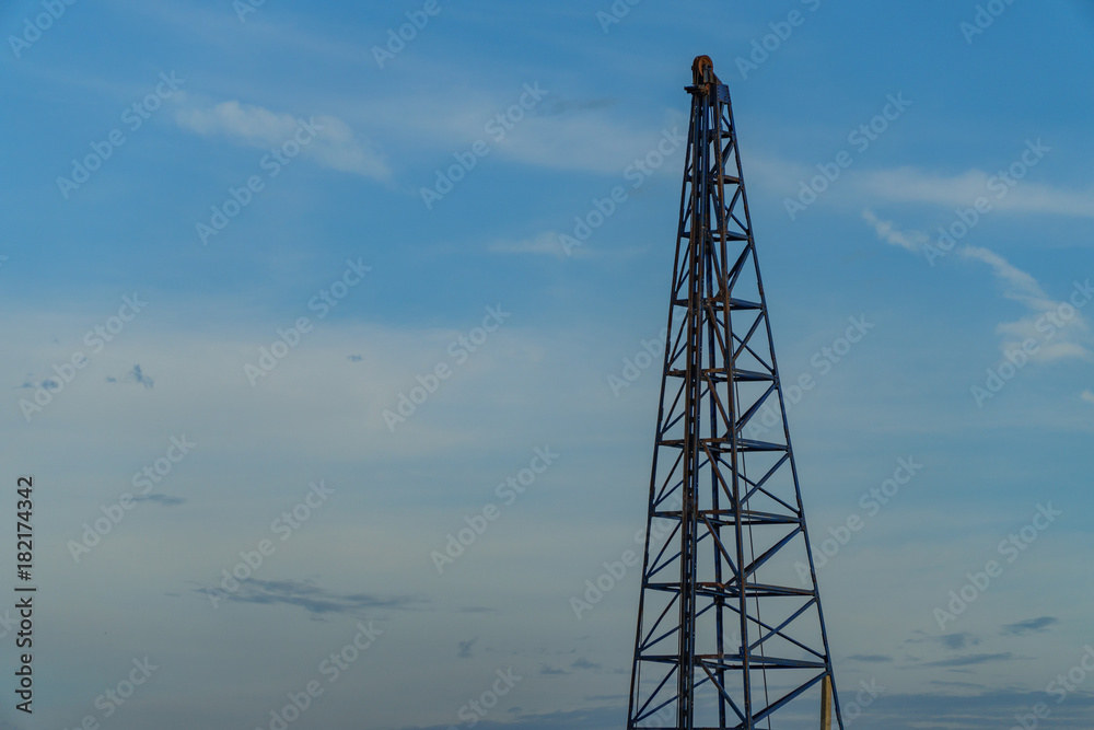 crane construction with blue sky in background crane construction with blue sky in background