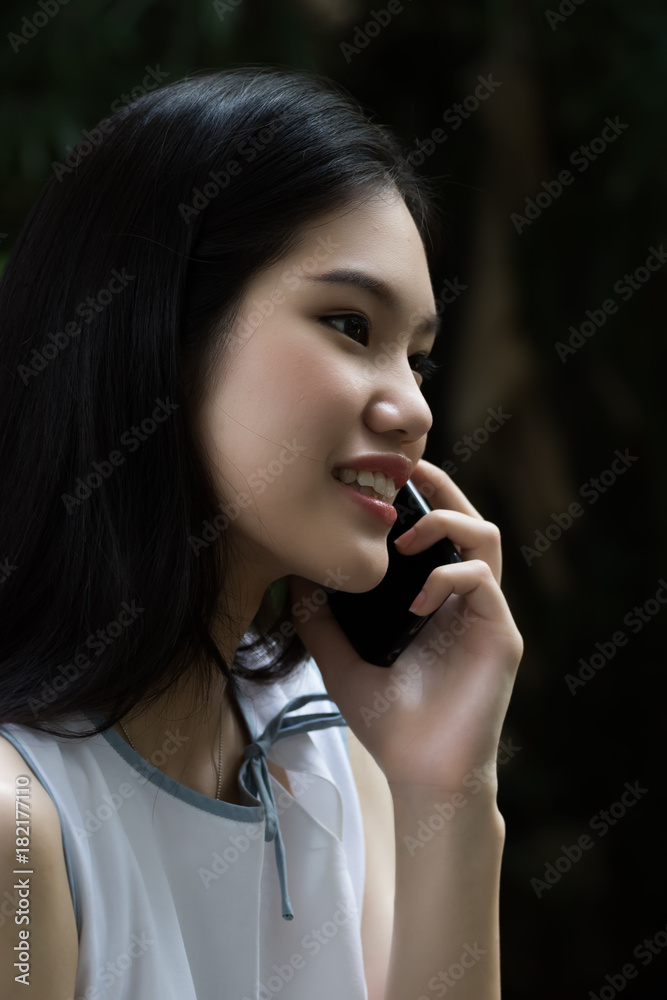 Asian woman are calling for business contract in blurred background Asian woman are calling for business contract in blurred background