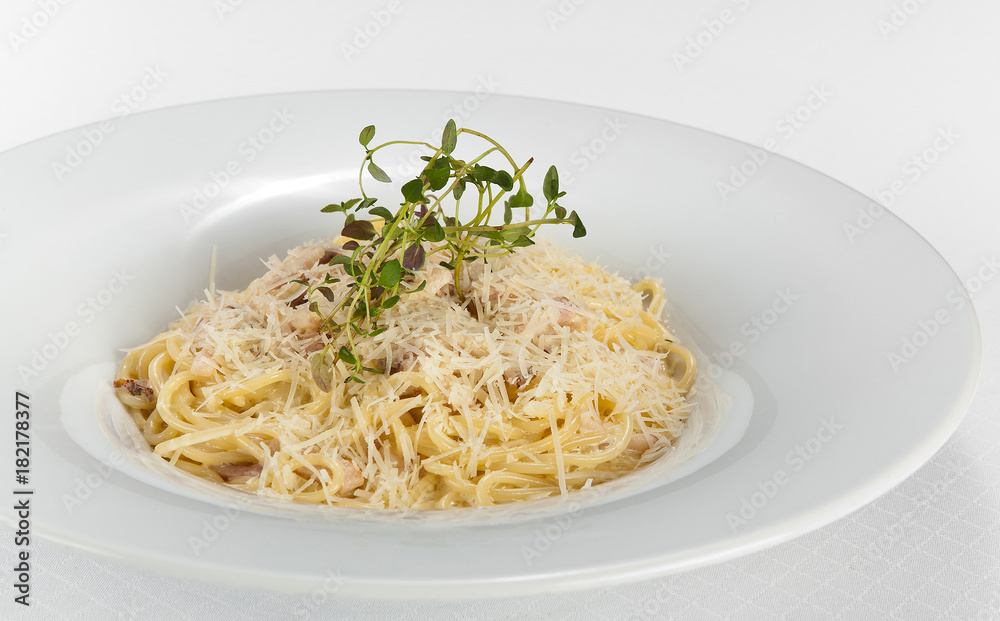 spaghetti carbonara with cream on white plate spaghetti carbonara with cream on white plate