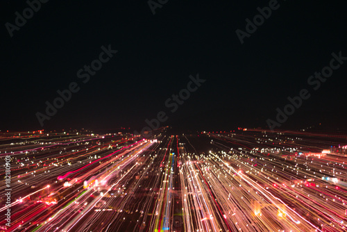 light lines with long exposure   speed motion abstract background in the dark night    blast zoom effect   zoom burst of light in the city