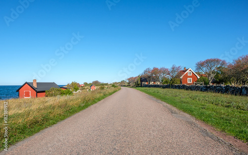 Traditional red cottage during autumn on Swedish Baltic sea island Oland. Oland is a popular tourist destination in Sweden during summertime.