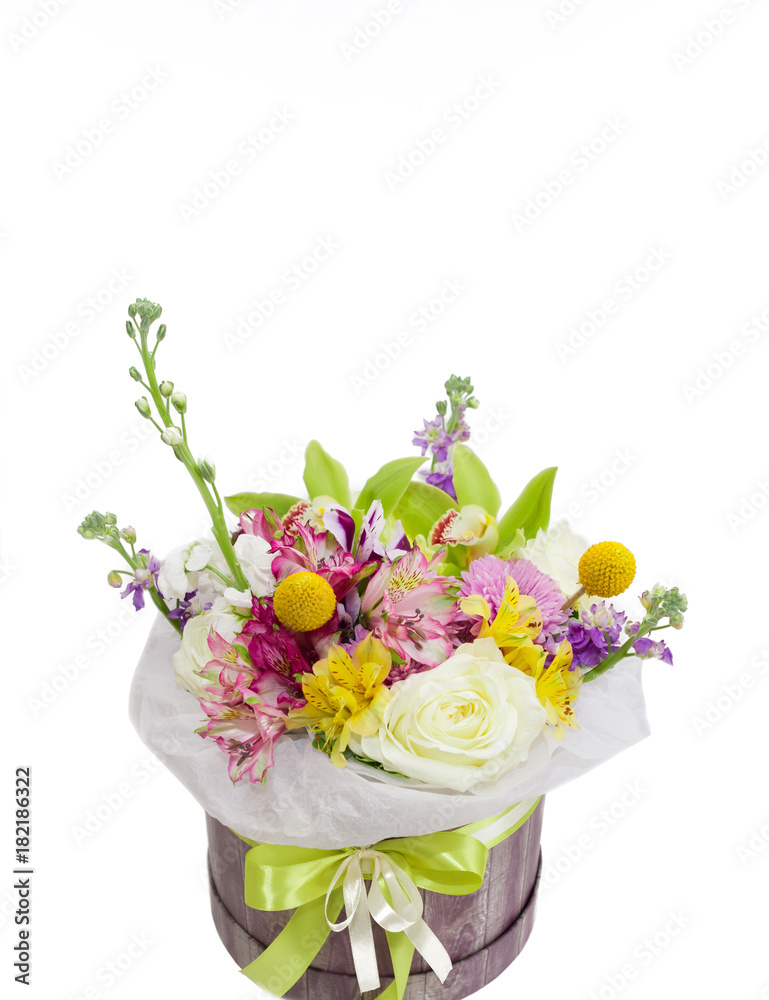 Bright flower bouquet in paper box isolated on white Bright flower bouquet in paper box isolated on white