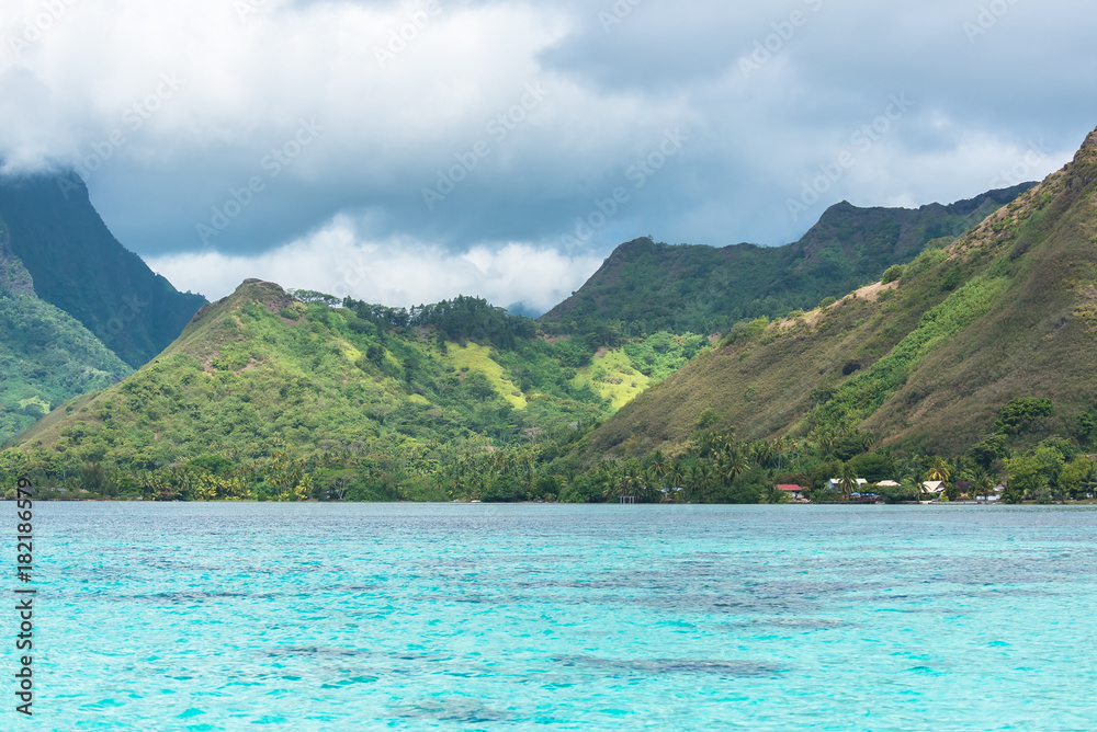 Moorea in french Polynesia, beautiful panorama of the lagoon, with the mountains in background 
