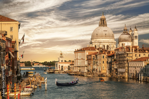 Grand Canal overlooking the Cathedral of Santa Maria della Salute and gondola with tourists  Venice  Italy