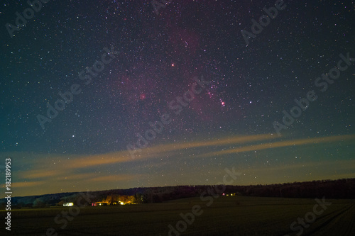 The Orion Constellation including Barnard’s Loop, the Orion Nebula, the Flame Nebula, and the Rosette Nebula as seen from Lemfoerde in Germany.