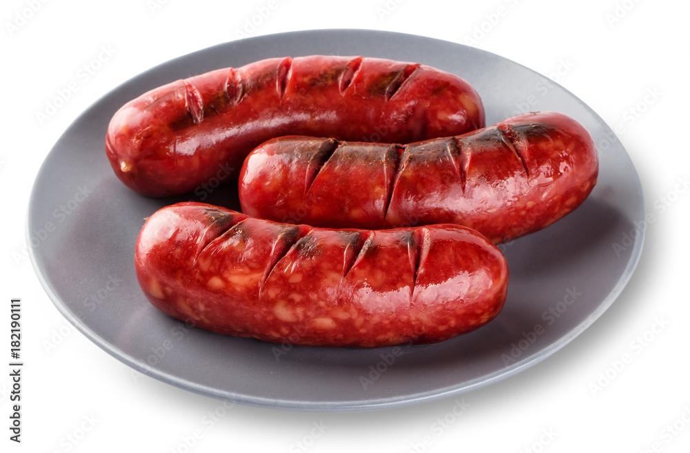 Grilled sausages cooked on a grill in gray plate Grilled sausages cooked on a grill in gray plate