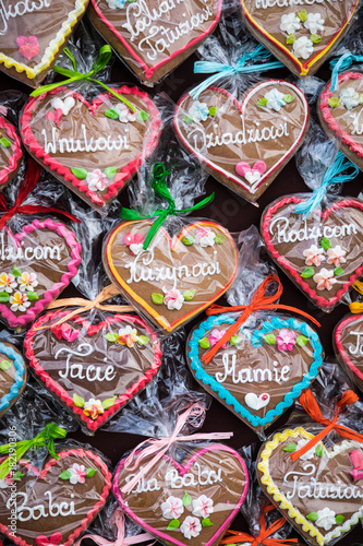 Gingerbread Hearts at Polish Christmas Market. Cracow. Xmas market in Poland. On traditional ginger bread cookies written "Dad, Mum,..." in Polish language.
