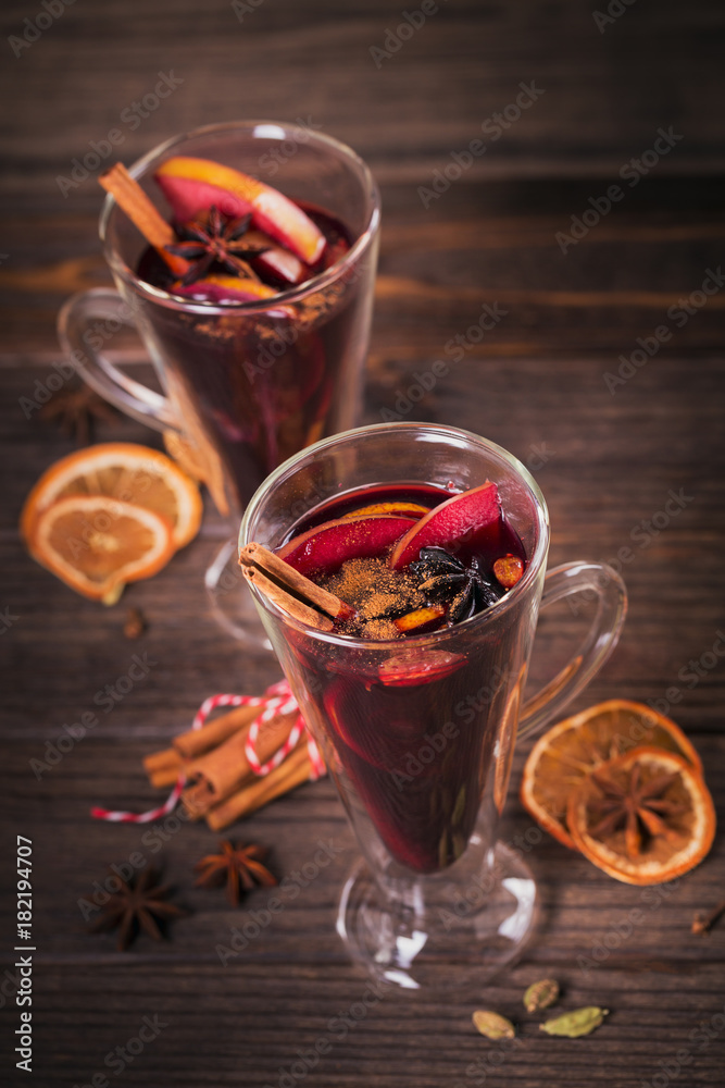 Mulled wine with fruits, cinnamon sticks, anise and decorations Mulled wine with fruits, cinnamon sticks, anise and decorations