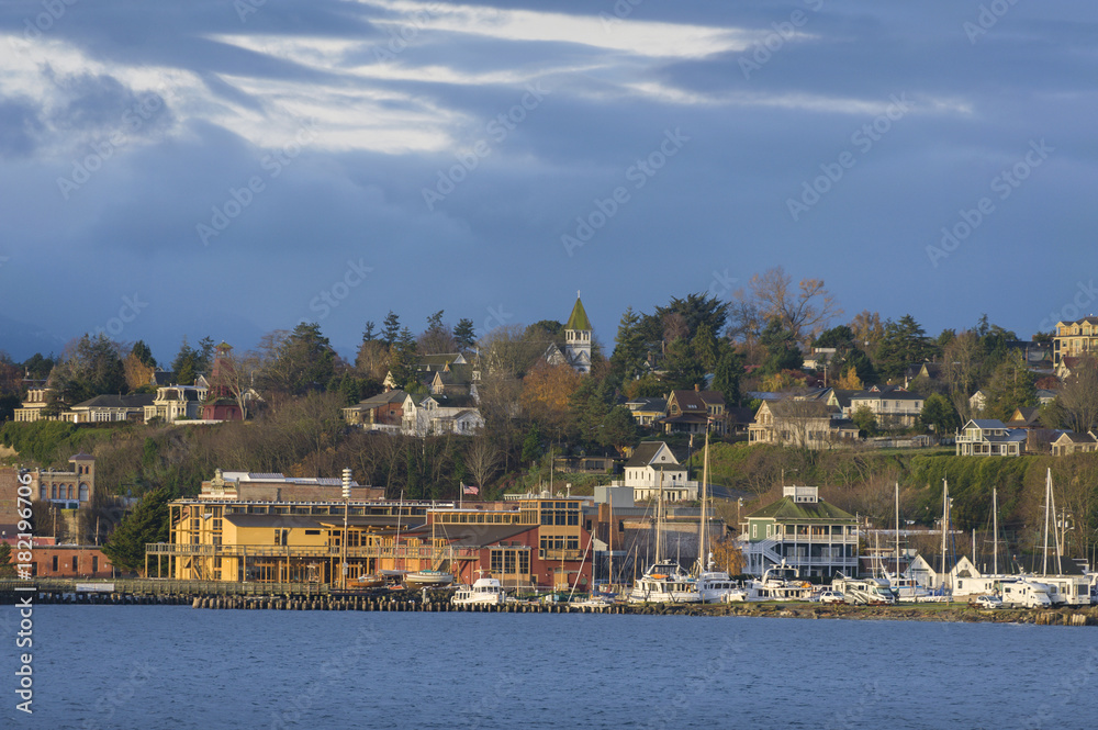 Historic Port Townsend, Washington Waterfront at Sunrise. By the late 19th century, Port Townsend was a well-known seaport. Beautiful Victorian houses and buildings can be seen most everywhere.