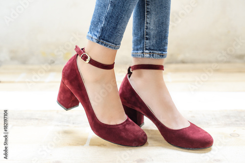 Vintage style shoes with heels worn on female legs with skinny jeans