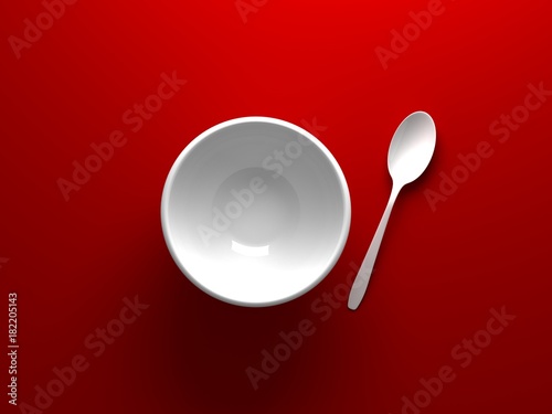 White Bowl and spoon placed on red background from top view 