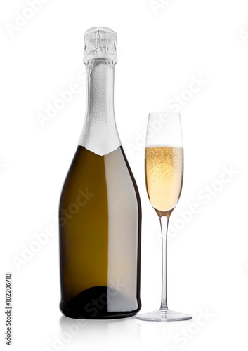 Bottle and glass of yellow champagne on white