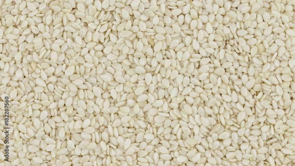 Sesame seeds close up. Loop rotation. Front of the camera rotates plate with sesame seeds Sesame seeds close up. Loop rotation. Front of the camera rotates plate with sesame seeds