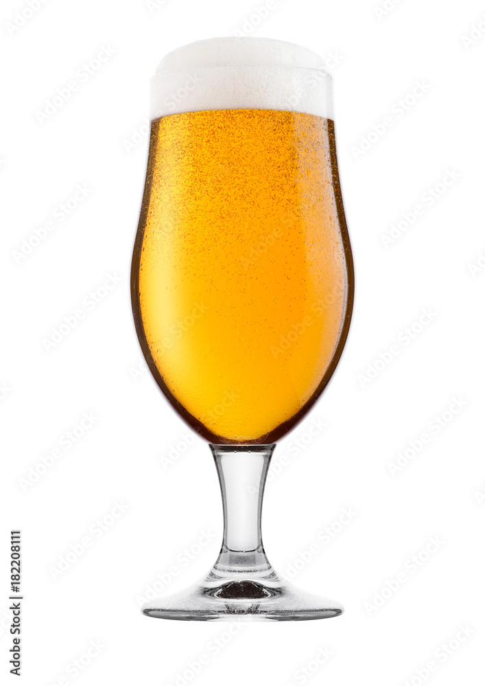 Cold glass of lager beer with foam and dew Cold glass of lager beer with foam and dew