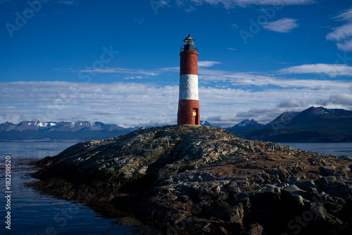Les Eclaireurs Lighthouse, Beagle Channel, Ushuaia, Tierra del Fuego, Argentinia. The city of Ushuaia and the Martial Glacier are visible in the background to the left.