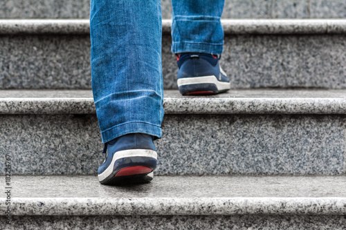 A man climbs the stairs