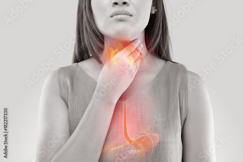 Woman Suffering From Acid Reflux Or Heartburn-Isolated On White Background photo