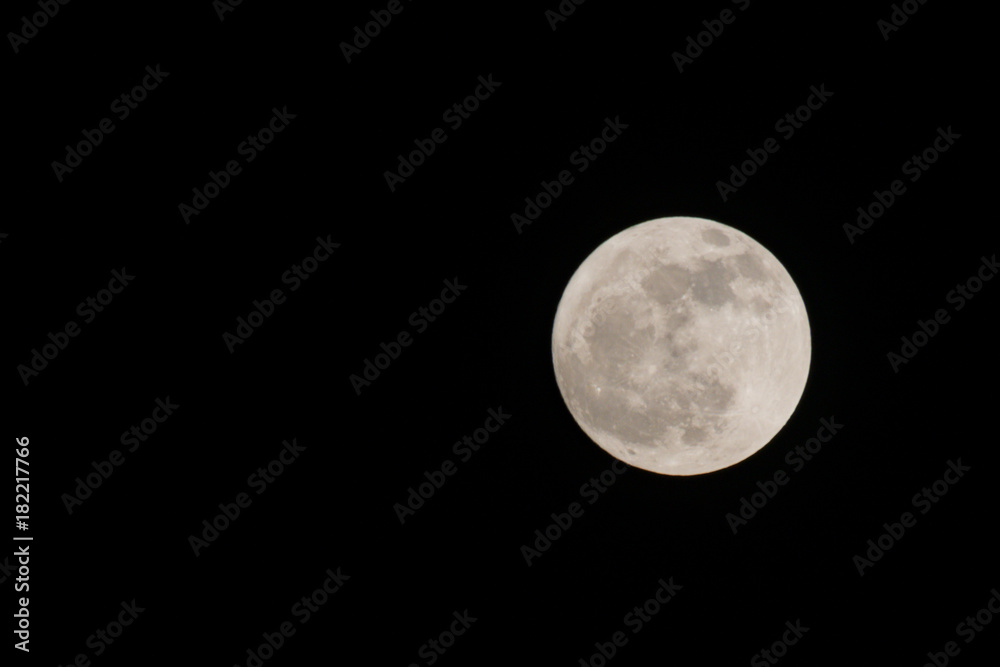 the detail of full moon on black background, zoom image the detail of full moon on black background, zoom image